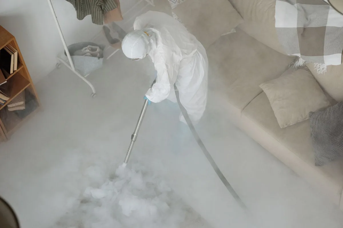 Biohazard cleanup technician in protective equipment, Clay, PA